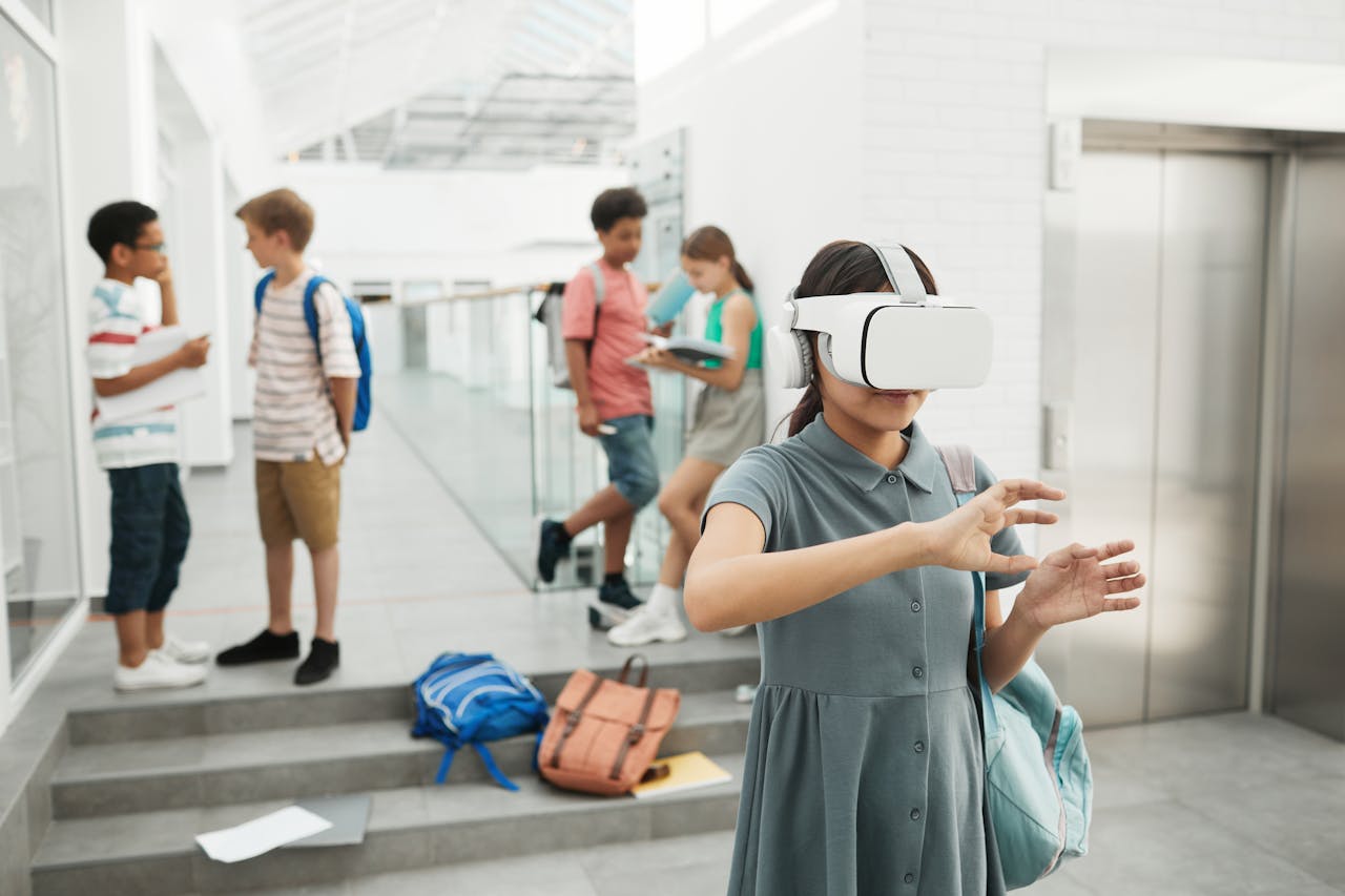 Group of students exploring virtual reality technology at a modern school setting.